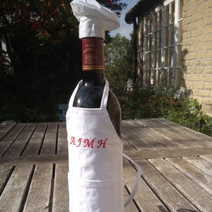 Bottle apron with chef's hat.
