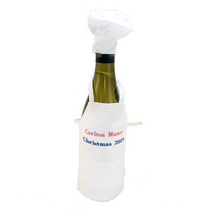 Bottle apron with chef's hat.